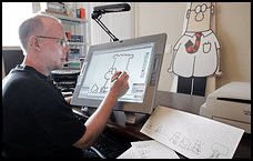 Photo of cartoonist Scott Adams, drawing his famous cartoon strip, "Dilbert" 
